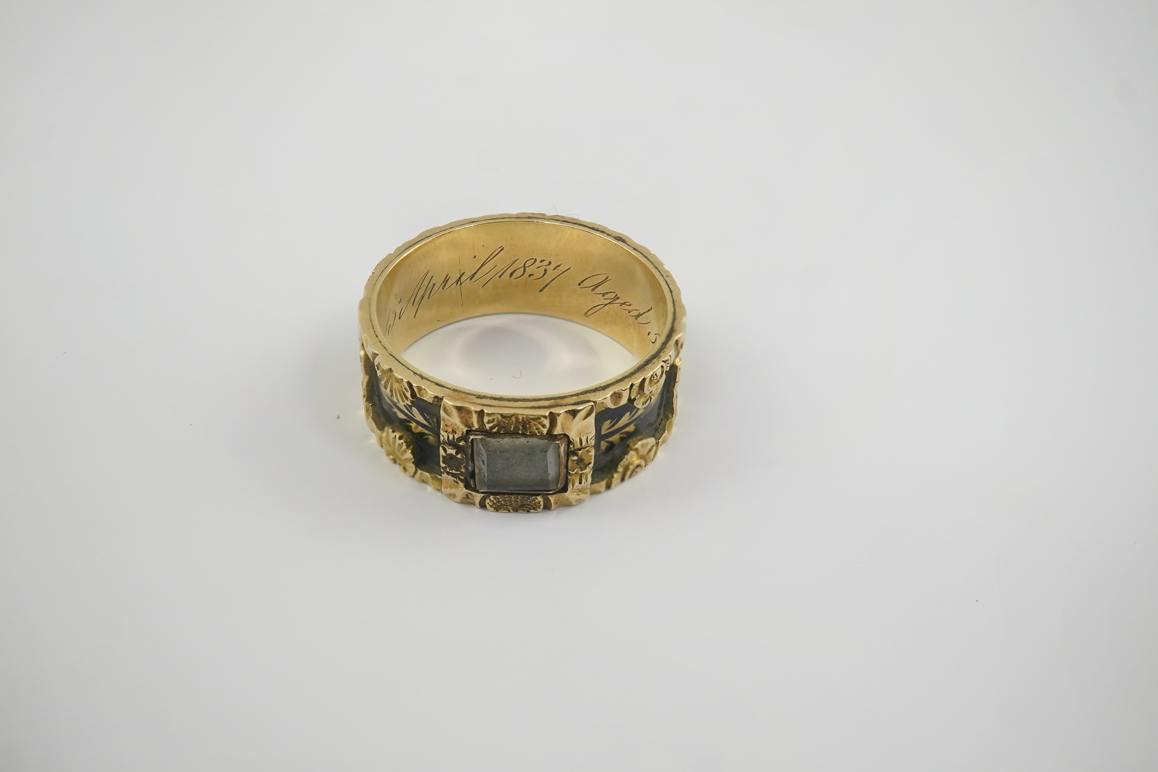 An early Victorian 18ct gold and black enamel initial mourning band